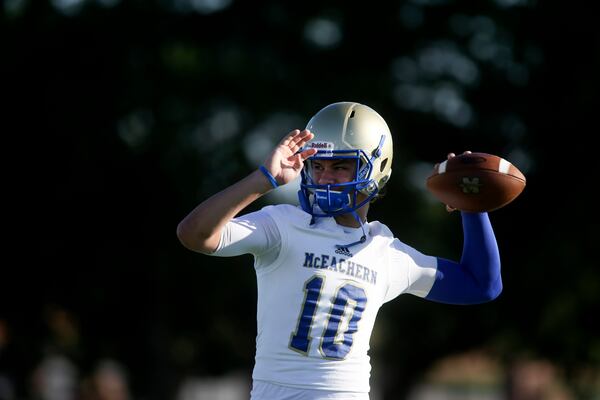 McEachern quarterback Bailey Hockman (1) warms up before their game against Buford on Sept. 5, 2014. (Jason Getz)