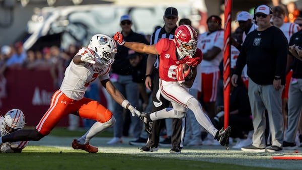 Alabama wide receiver Kobe Prentice (6) runs the ball past Mercer safety Carmelo O'Neal (7) during the second half of an NCAA college football game, Saturday, Nov. 16, 2024, in Tuscaloosa, Ala. (AP Photo/Vasha Hunt)