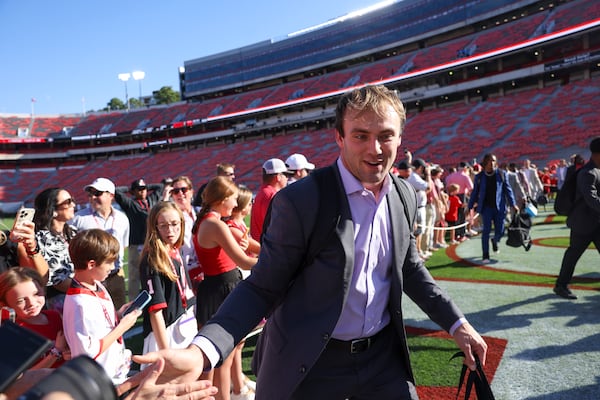 Georgia tight end Brock Bowers greets fans during the Dawg Walk before Georgia’s game against UAB at Sanford Stadium, Saturday, September 23, 2023, in Athens, Ga. (Jason Getz / Jason.Getz@ajc.com)