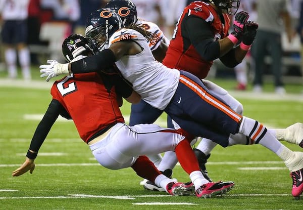 Caught in a Bear hug: That's Matt Ryan. (Curtis Compton/AJC photo)