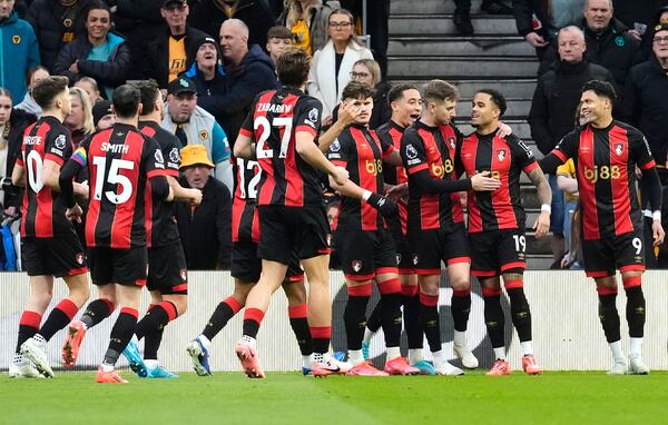 Bournemouth's Justin Kluivert, second right, celebrates scoring with teammates during the English Premier League soccer match at Molineux Stadium, Wolverhampton, England, Saturday Nov. 30, 2024. (Nick Potts/PA via AP)