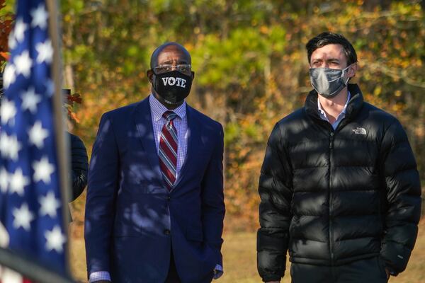 Democrats Raphael Warnock, left, and Jon Ossoff benefited from a combined effort to reach out to voters. Thousands of staffers and more than 40,000 volunteers made more than 25 million voter contacts. (Chang W. Lee/The New York Times)