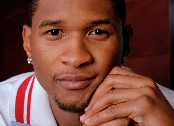 Usher poses in the W Hotel at Union Square in New York, April 1, 2002. (AP Photo/Jim Cooper)