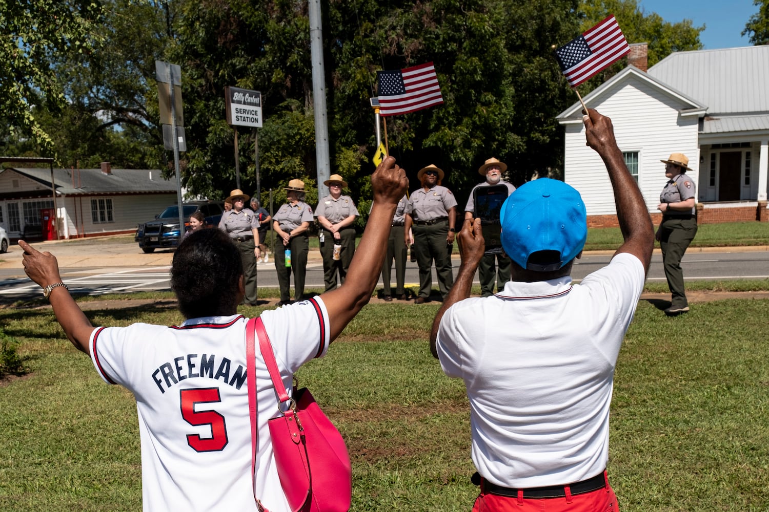 Sherrell and Derrell Dowdell of Americus sing and conduct a rendition of Happy Birthday for President Jimmy Carter’s 100th birthday in Plains on Tuesday, Oct. 1, 2024. Ben Gray for the Atlanta Journal-Constitution