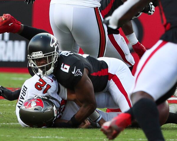 Tampa Bay Buccaneers quarterback Tom Brady (12) is sacked by Falcons defensive end Dante Fowler Jr. (6) as he fumbles the ball during the first half  Sunday, Sept. 19, 2021, at Raymond James Stadium in Tampa. (Dirk Shadd/Tampa Bay Times)