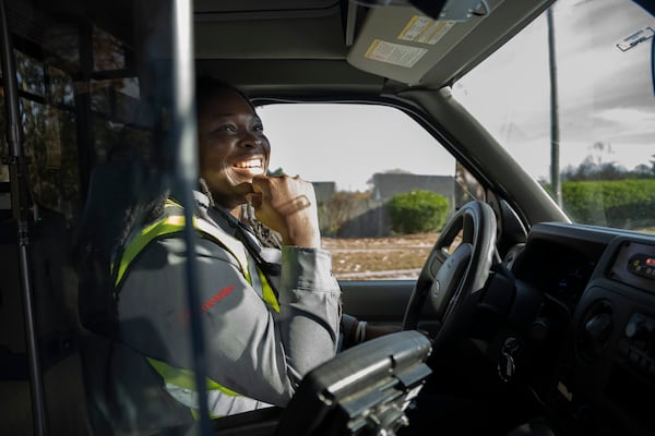 Bus driver, Tiese Daniels, pulls up to a suburban park to pick up passengers in Snellville, Georgia on Wednesday, Nov. 27, 2024 (Olivia Bowdoin for the AJC).