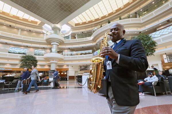 November 15, 2016 - Atlanta - Dwan Bosman performs in the Atrium. Hartsfield-Jackson uses live musicians to calm and entertain travelers in the terminal and on the concourses. BOB ANDRES /BANDRES@AJC.COM