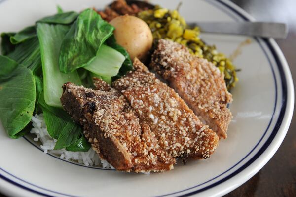 Fried pork chop over rice. (BECKY STEIN PHOTOGRAPHY)