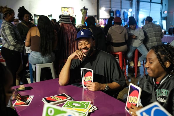 Controllerise attendees play Uno and other games. Courtesy of Fulani Jabri