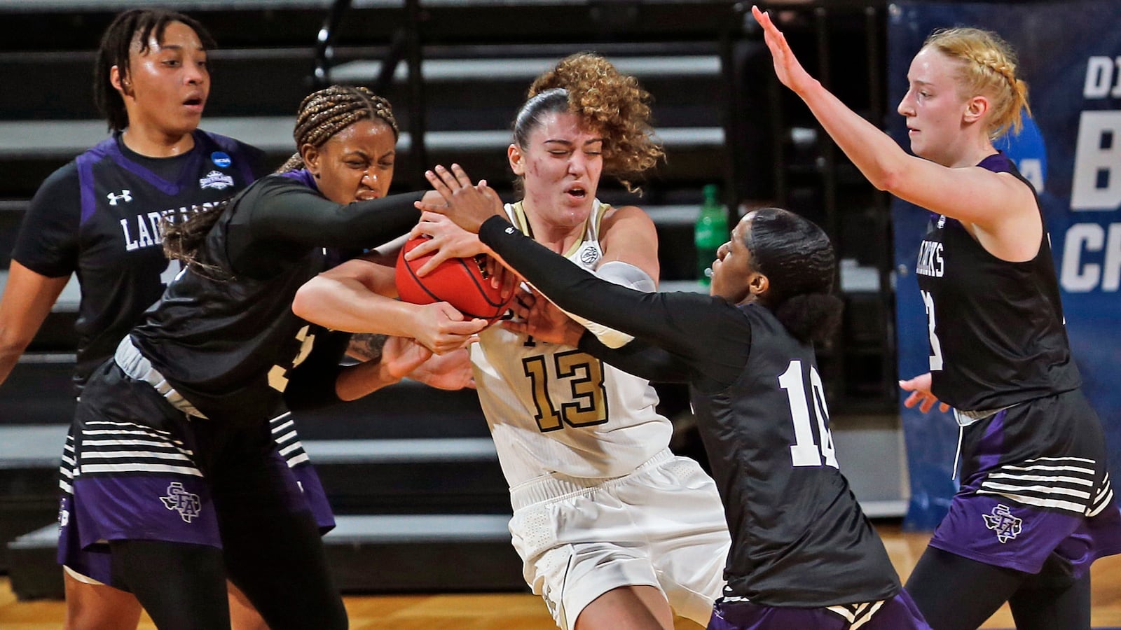 Georgia Tech forward Lorela Cubaj (13) is tied up by a host of Stephen F. Austin players during the first half of their first-round women's NCAA Tournament Sunday, March 21, 202, at the Greehey Arena in San Antonio, Texas. (Ronald Cortes/AP)