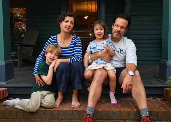 Sarah O'Brien, husband Paul Calvert, their eight-year-old son Wally and four-year-old daughter Stevie sit on the front porch of their home in Atlanta's Grant Park neighborhood. (CHRIS HUNT FOR THE ATLANTA JOURNAL-CONSTITUTION)