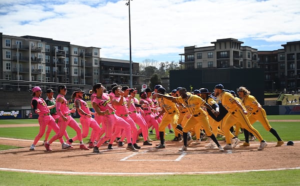 Party Animals and Savannah Bananas players have a dance battle before the game. (Hyosub Shin / Hyosub.Shin@ajc.com)