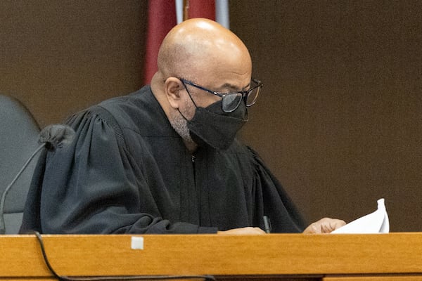 Fulton County Superior Court Chief Judge Ural Glanville looks over paperwork as the Jury selection portion of the trial continues Tuesday, Jan. 24, 2023.  Glanville is also presiding over the death penalty case against Robert Aaron Long. (Steve Schaefer/steve.schaefer@ajc.com)