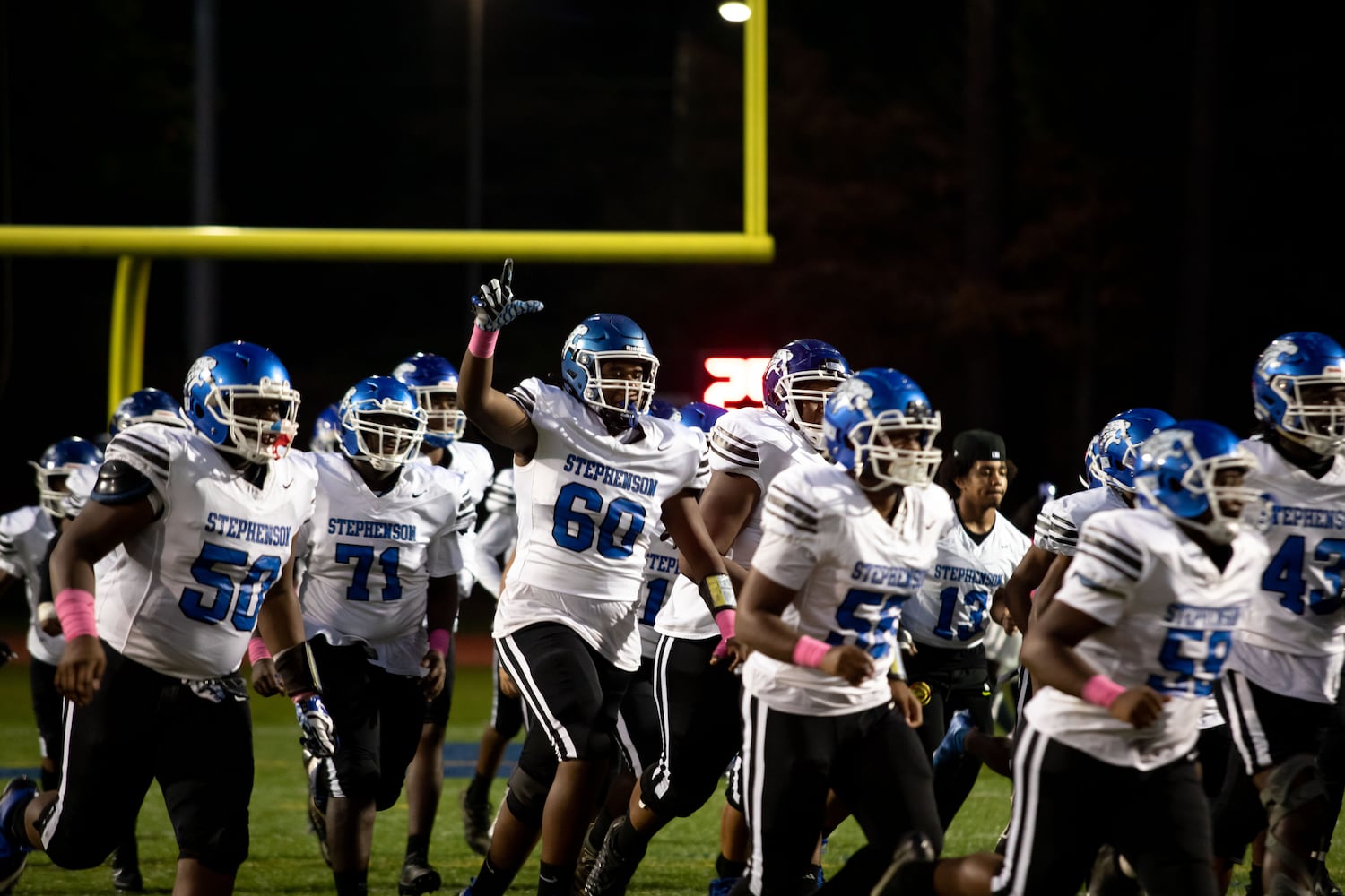 The Stephenson High School Jaguars take the field during a GHSA high school football game between Stephenson High School and Miller Grove High School at James R. Hallford Stadium in Clarkston, GA., on Friday, Oct. 8, 2021. (Photo/Jenn Finch)