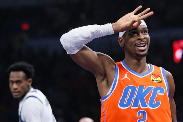 Oklahoma City Thunder guard Shai Gilgeous-Alexander gestures after making a 3-pointer during the first half of an Emirates NBA Cup basketball game against the Dallas Mavericks, Tuesday, Dec. 3, 2024, in Oklahoma City. (AP Photo/Nate Billings)