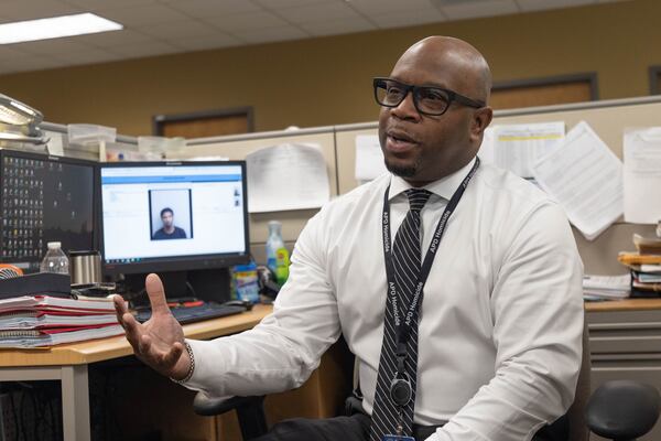 Investigator Calvin Thomas became a police officer after the 2003 killing of his aunt. Branden Camp/For the Atlanta Journal-Constitution