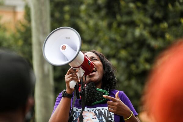 Yonasda LoneWolf speaks during a rally at Cleopas Park in Atlanta. (ALYSSA POINTER / Alyssa.Pointer@ajc.com)