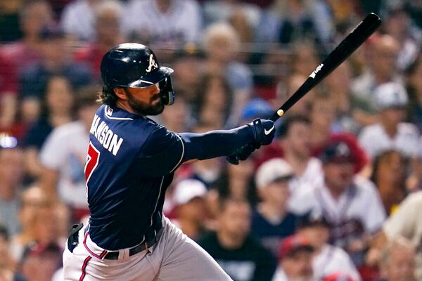 Atlanta Braves' Dansby Swanson follows through on his RBI double off Boston Red Sox relief pitcher Garrett Whitlock during the eighth inning of a baseball game, Tuesday, Aug. 9, 2022, in Boston. (AP Photo/Charles Krupa)