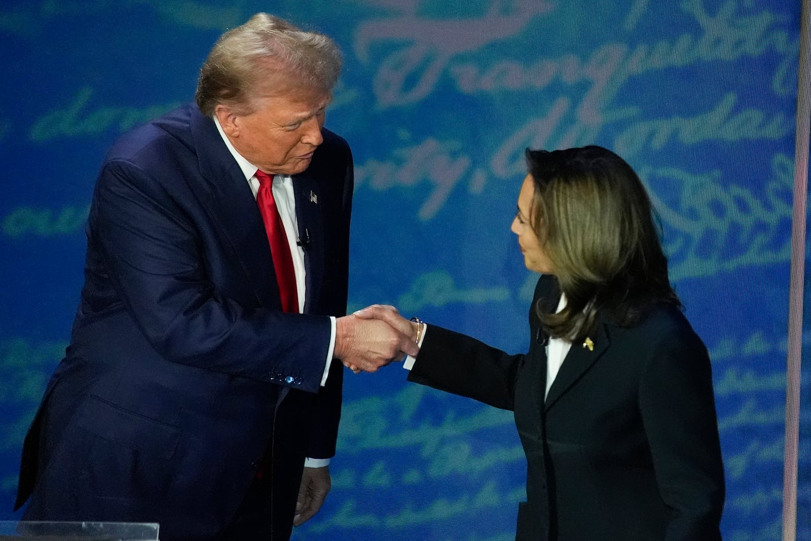 Democratic presidential nominee Vice President Kamala Harris greets Republican presidential nominee former President Donald Trump with a handshake before the start of a the presidential debate Sept. 10 in Philadelphia. Alex Brandon/AP 