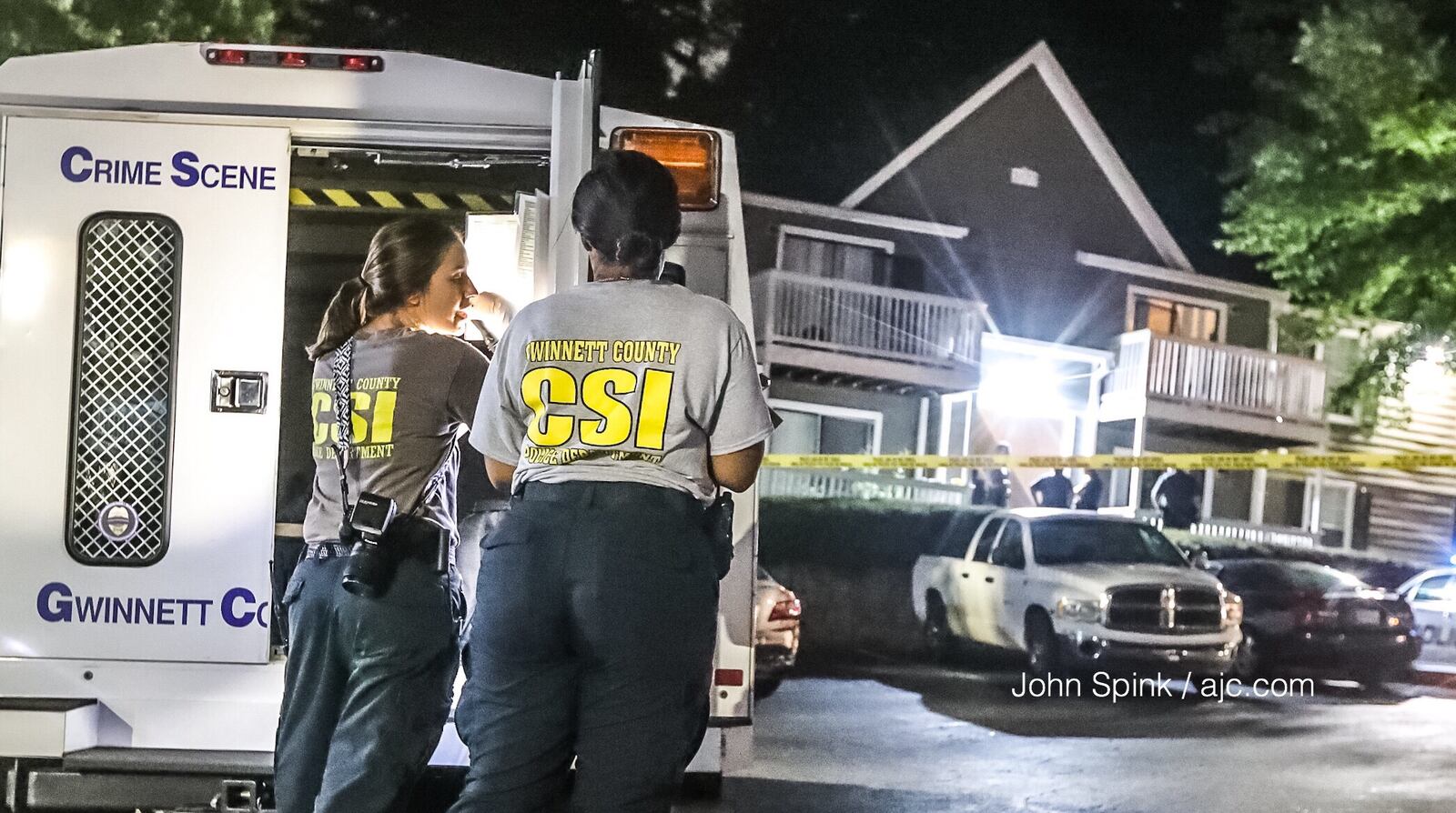 Crime scene investigators respond to the scene of a shooting at the Fields at Peachtree Corners Apartments on Tuesday morning.