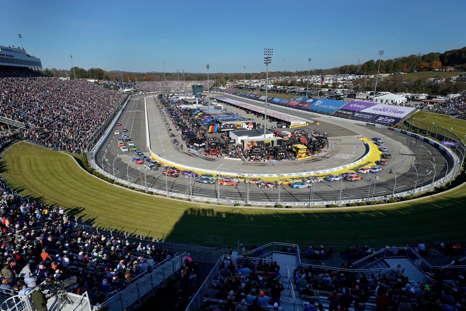 Drivers race their cars in Turns 1 and 2 during a NASCAR Cup Series auto race at Martinsville Speedway in Martinsville, Va., Sunday, Nov. 3, 2024. (AP Photo/Chuck Burton)