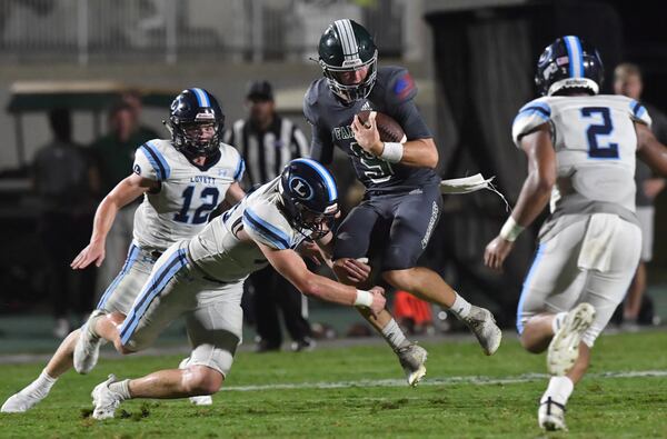 Westminster quarterback John Collier (9) gets tackled by Lovett's Garrett Kelly (88) in the second half of their season opener Friday, Aug. 20, 2021, at The Westminster Schools in Atlanta. Westminster won 17-7. (Hyosub Shin / Hyosub.Shin@ajc.com)