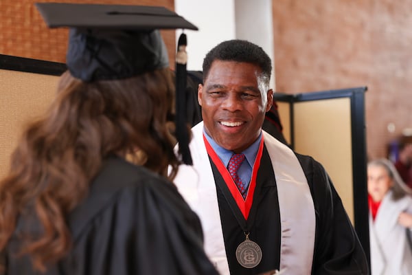 Former Georgia running back Herschel Walker talks with fellow graduates before the fall graduation ceremony for the University of Georgia’s College of Family and Consumer Sciences, at Mahler Hall, Thursday, December 12, 2024, in Athens, Ga. (Jason Getz/AJC)
