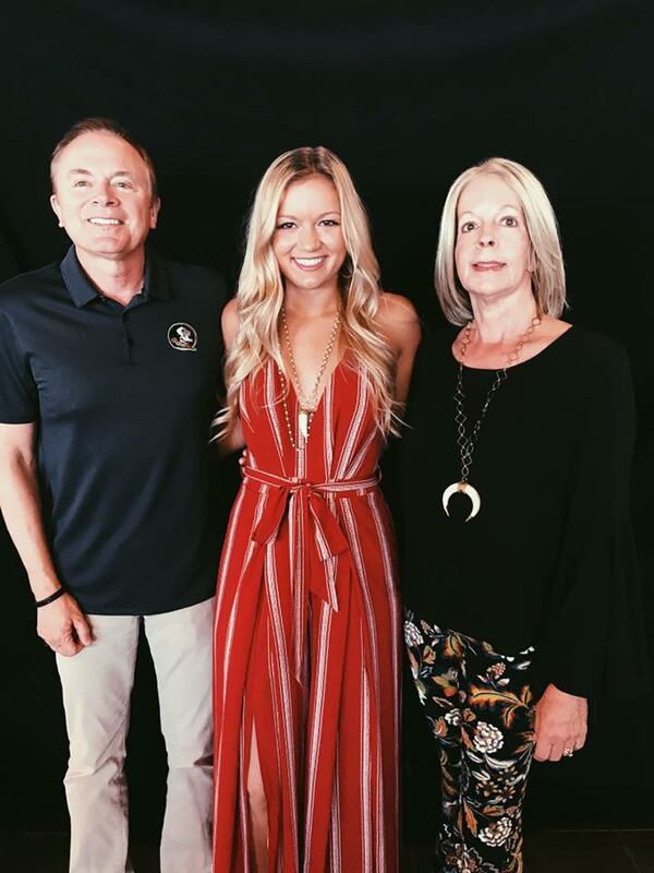 Maura Binkley, who was shot and killed Friday at a yoga class in Tallahassee, with her parents, Jeff and Margaret Binkley. (Family photo)