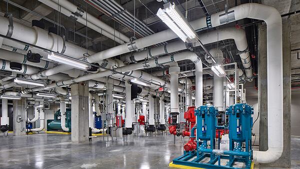 Large cooling tanks and water pumps lie beneath DataBank's three-story data center at Coda at Technology Square in Midtown. Water is used to prevent rows of computer servers and other technology from overheating.