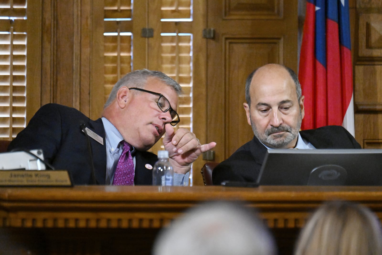 Executive Director Mike Coan (left) and Chairman John Fervier speak during the State Election Board's final scheduled meeting of 2024. 