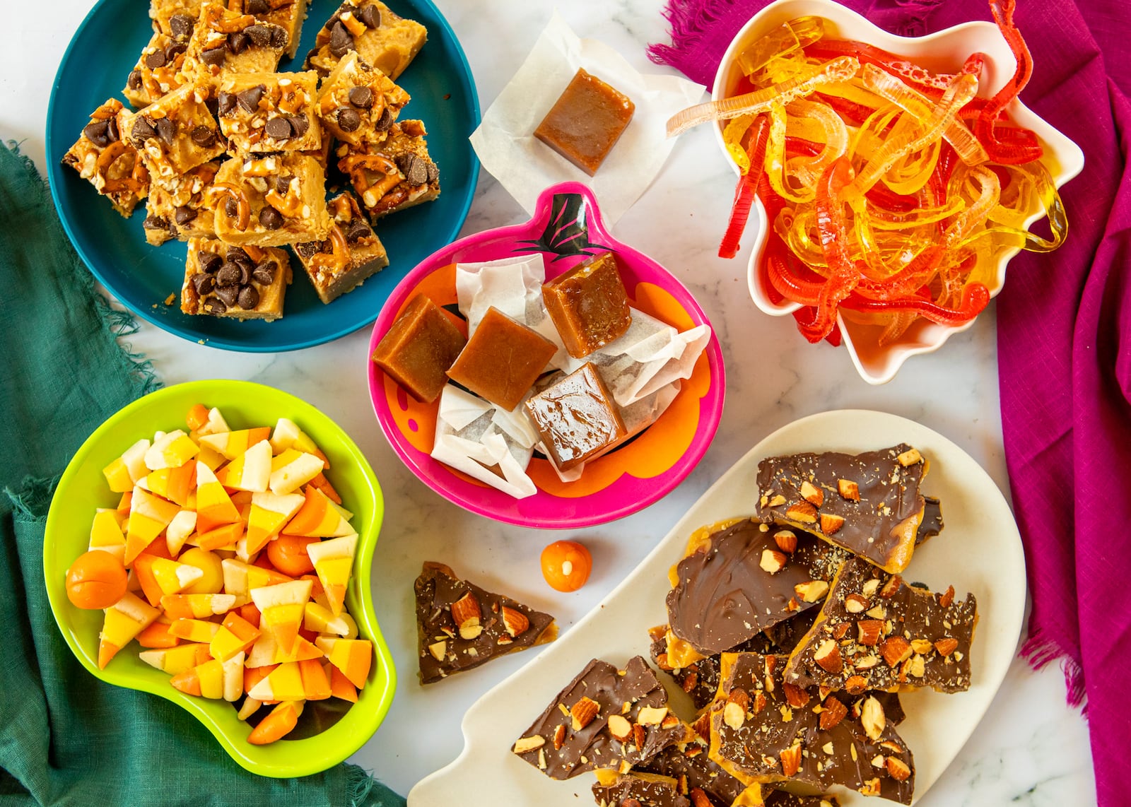 From top left, clockwise: Nut butter fudge, salted caramels, gummy worms, toffee and candy corn.