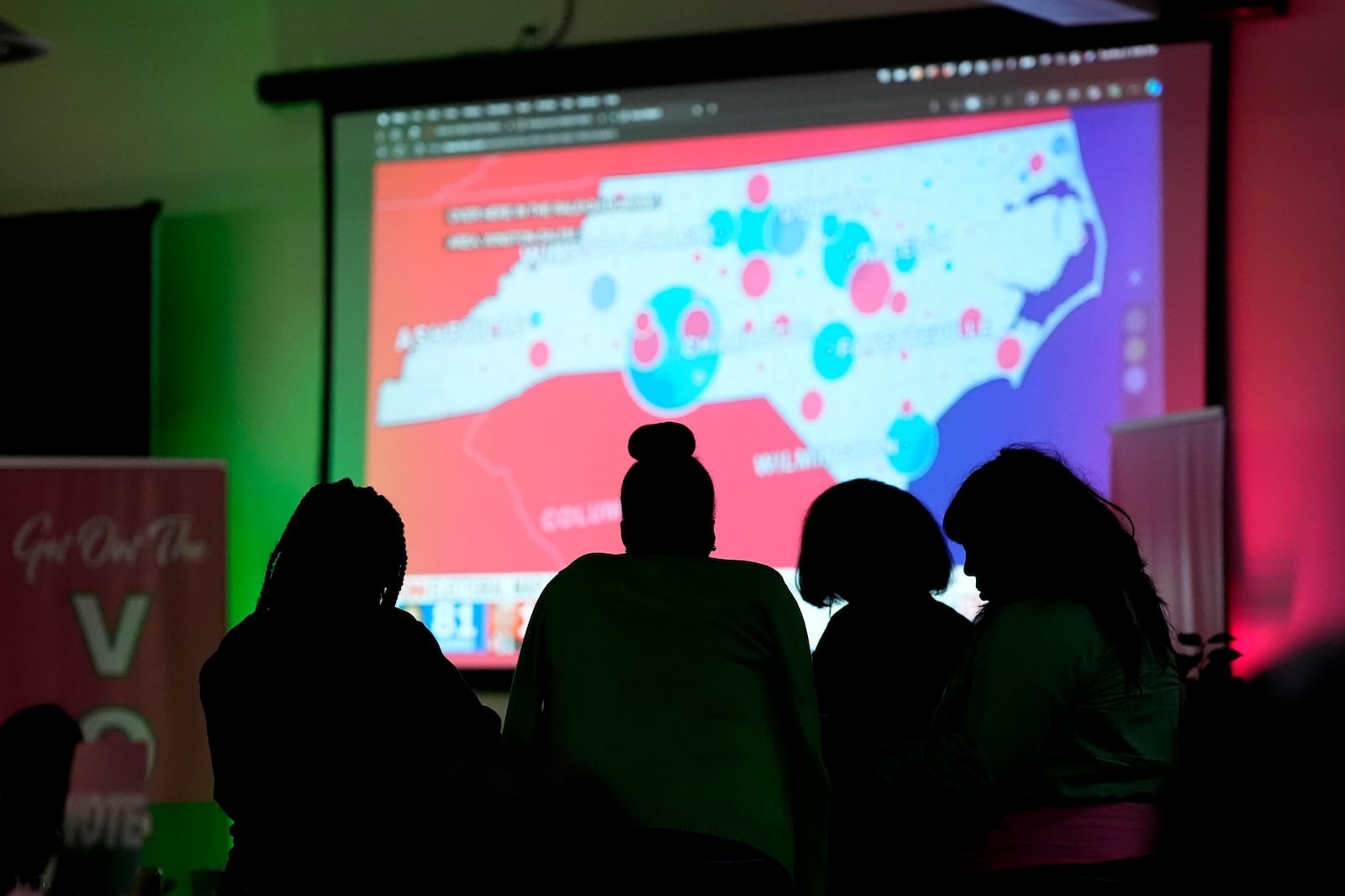 Members of the Alpha Kappa Alpha sorority stand in silhouette as they attend an election watch party Tuesday, Nov. 5, 2024, in Chicago. (AP Photo/Charles Rex Arbogast)