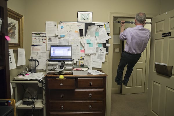 10/24/2019 — Augusta, Georgia — Dr. John Downey strives to do a few pull ups every time he leaves his office at the Royal Pain Center in Augusta, Thursday, October 24, 2019. His goal on Thursday was to complete more than 100 pull-ups. His office was scheduled to see 112 patients on Thursday. (Alyssa Pointer/Atlanta Journal Constitution)