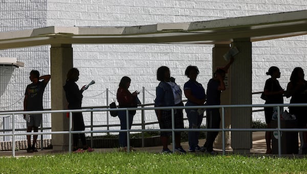 Miami-Dade residents wait in line to vote at the Joseph Caleb Center during the "Souls to the Polls" event on the last day of early voting Sunday, Nov. 3, 2024, in Miami. (Carl Juste/Miami Herald via AP)