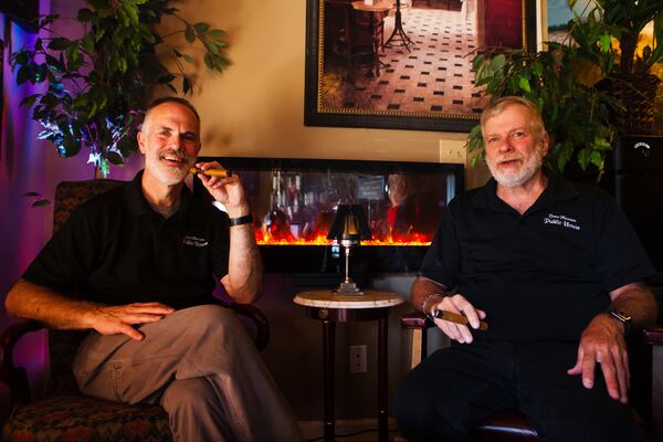 Rory Webb and Jeff Carey, owners of Stone Mountain Public House, pose for a portrait on Saturday, January 23, 2021, at Stone Mountain Public House in Stone Mountain, Georgia. Webb and Carey were forced to close Stone Mountain Public House due to the coronavirus pandemic, but are applying for a relief grant to help fund its reopening as a piano bar and cigar lounge. CHRISTINA MATACOTTA FOR THE ATLANTA JOURNAL-CONSTITUTION