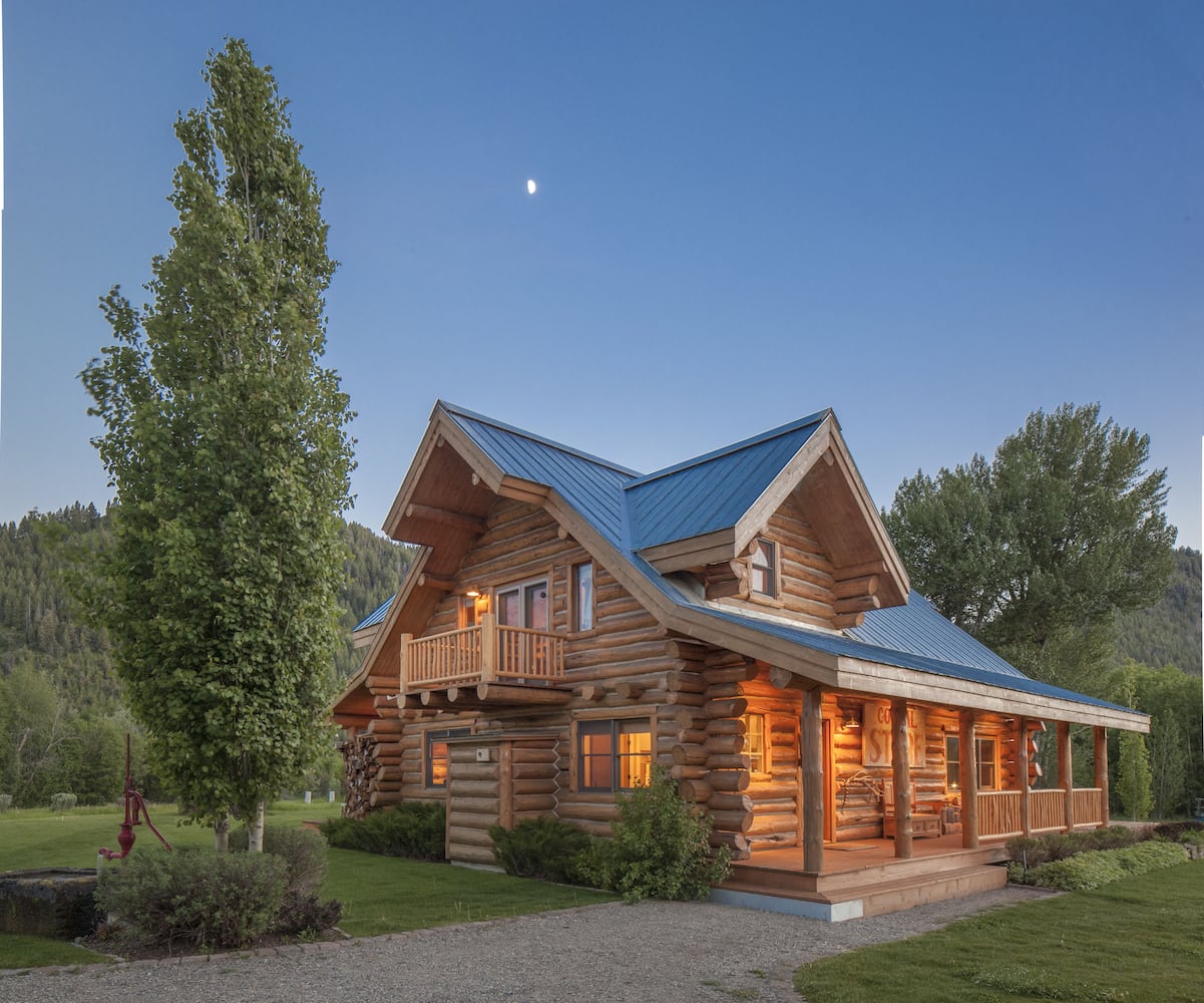 500-acre property has log cabins, mountain views