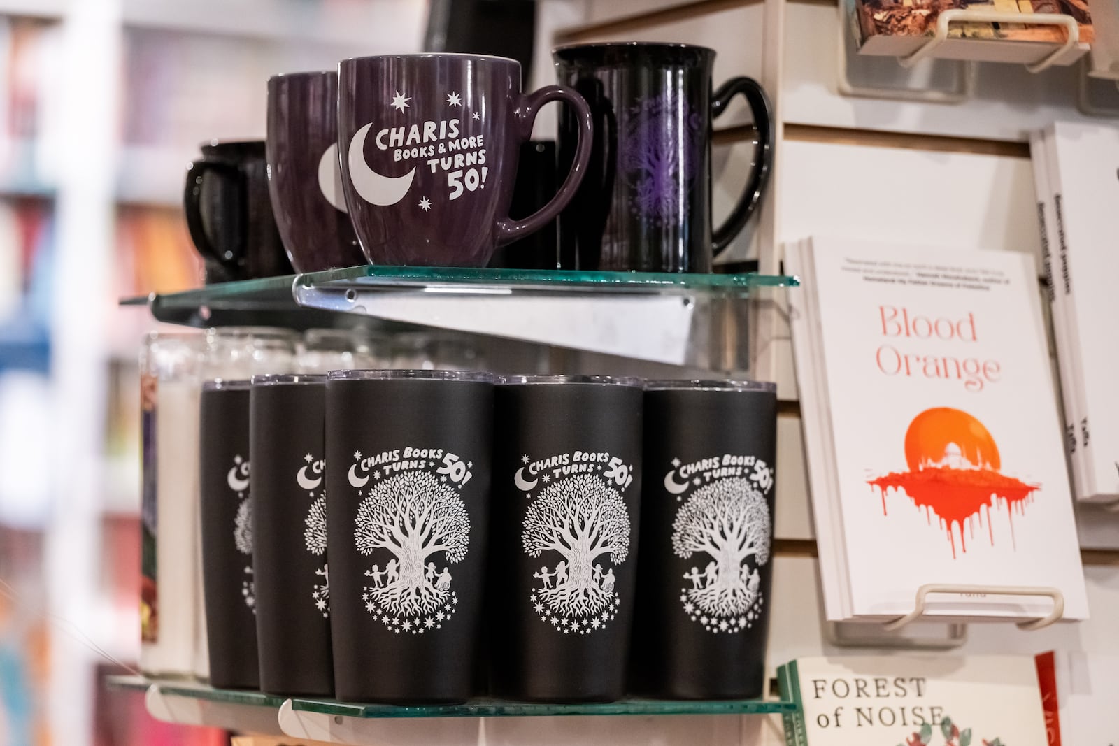 Mugs and tumblers commemorating the 50th anniversary of Charis Books & More are for sale at the indie bookstore in Decatur.  
(Bita Honarvar for The Atlanta Journal-Constitution)