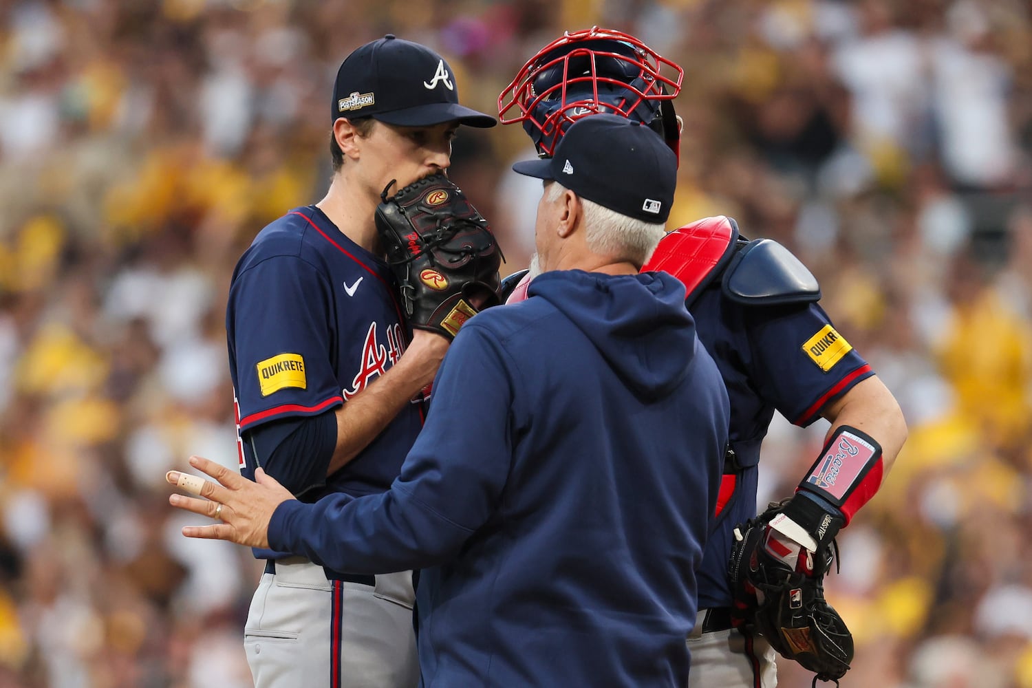 Atlanta Braves pitcher Max Fried (54) is settled down by pitching coach Rick Kranitz (39) during the second inning of National League Division Series Wild Card Game Two at Petco Park in San Diego on Wednesday, Oct. 2, 2024.   (Jason Getz / Jason.Getz@ajc.com)