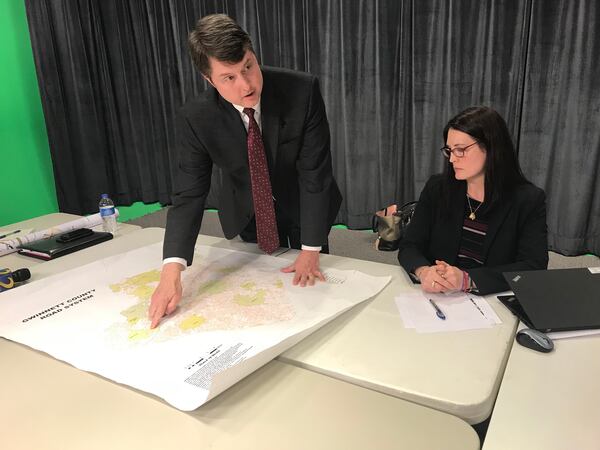 Gwinnett Departmentof Transportation Director Alan Chapman discusses the county's comprehensive transit plan during a Thursday media briefing as consultant Cristina Pastore looks on. TYLER ESTEP / TYLER.ESTEP@AJC.COM