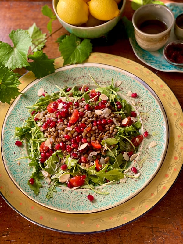 Paulina Brand’s Arugula with Warm Lentils and Pomegranate is the perfect healthy meal for winter. Courtesy of Paulina Brand