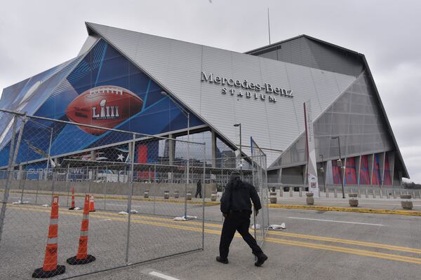 Security staff are visible around Mercedes-Benz Stadium on Thursday, Jan. 24, 2019. HYOSUB SHIN / HSHIN@AJC.COM