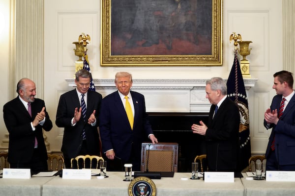 Secretary of Commerce Howard Lutnick, from left, Treasury Secretary Scott Bessent, President Donald Trump, White House AI and crypto czar David Sacks and Bo Hines, a member of the presidential council of advisers for digital assets, attend the White House Crypto Summit in Washington, Friday, March 7, 2025. (Pool via AP)