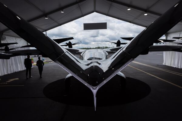 A demo of Archer’s Midnight electric vertical take-off and landing (eVTOL) aircraft sits in a tent at DeKalb-Peachtree Airport in Atlanta on Thursday, July 25, 2024. (Arvin Temkar / AJC)