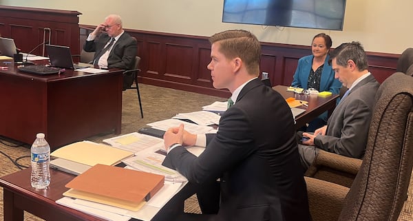 A three-day trial in McDuffie County superior court included evidence of ineligible voters in a race for Georgia House District 128. From left: Mark Davis, a data expert for the plaintiffs; attorney Jake Evans; Republican candidate Tracy Wheeler; and attorney Philip Georgia. Mark Niesse / mark.niesse@ajc.com