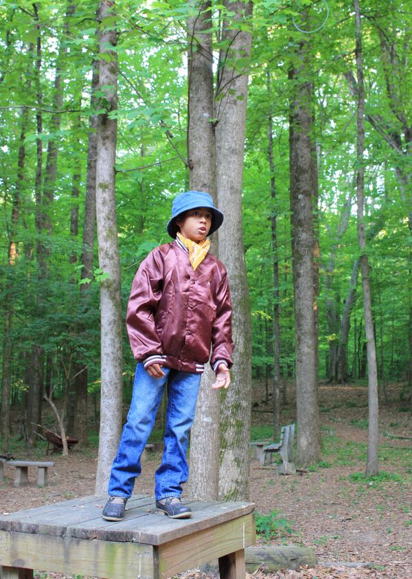 Brandon (Kyrun Walker-Smith) prepares attendees for the journey through the woods in playwright Addae Moon’s “Cassie’s Ballad.”