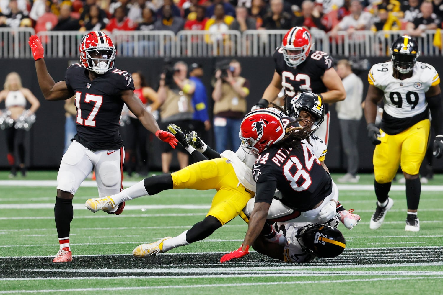 Falcons running back Cordarrelle Patterson gets stopped by Steelers safety Terrell Edmunds and cornerback Levi Wallace during the second quarter Sunday at Mercedes-Benz Stadium. (Miguel Martinez / miguel.martinezjimenez@ajc.com)