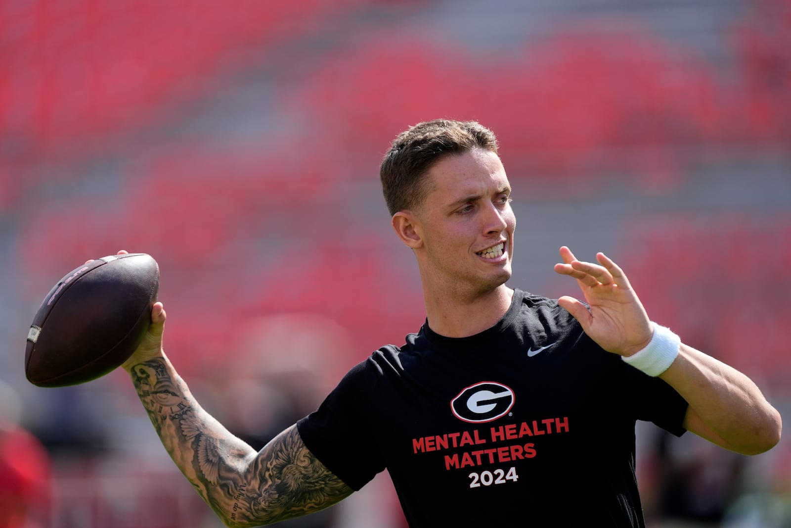 Georgia quarterback Carson Beck warms up before an NCAA college football game against Auburn Saturday, Oct. 5, 2024, in Athens, Ga. (AP Photo/John Bazemore)