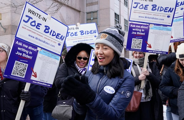 Boston Mayor Michelle Wu joins supporters demonstrating at a write-in rally for Joe Biden. The president skipped the New Hampshire primary after national Democrats decided to move South Carolina — and its far more diverse electorate — ahead of the state on the schedule of primaries and caucuses. (Timothy A. Clary/AFP/Getty Images/TNS)