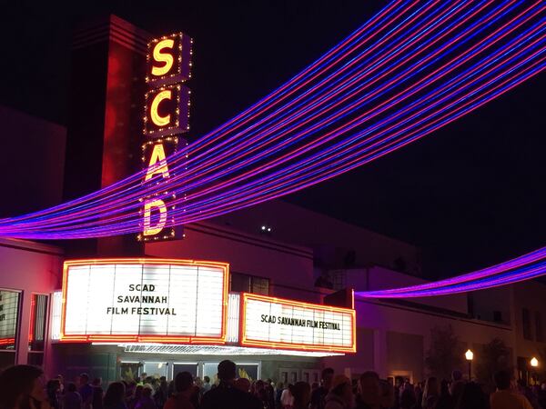 Brightly lit streamers decorated the street outside the Trustees Theater on opening night of the Savannah College of Art and Design’s annual film festival on Oct. 28. ALAN JUDD/ajudd@ajc.com