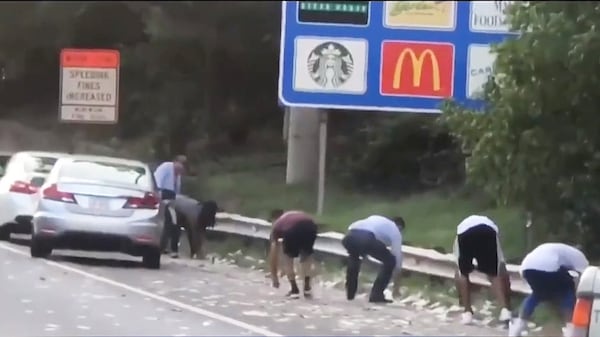 Videos went viral showing drivers stopping to collect cash on the side of I-285.